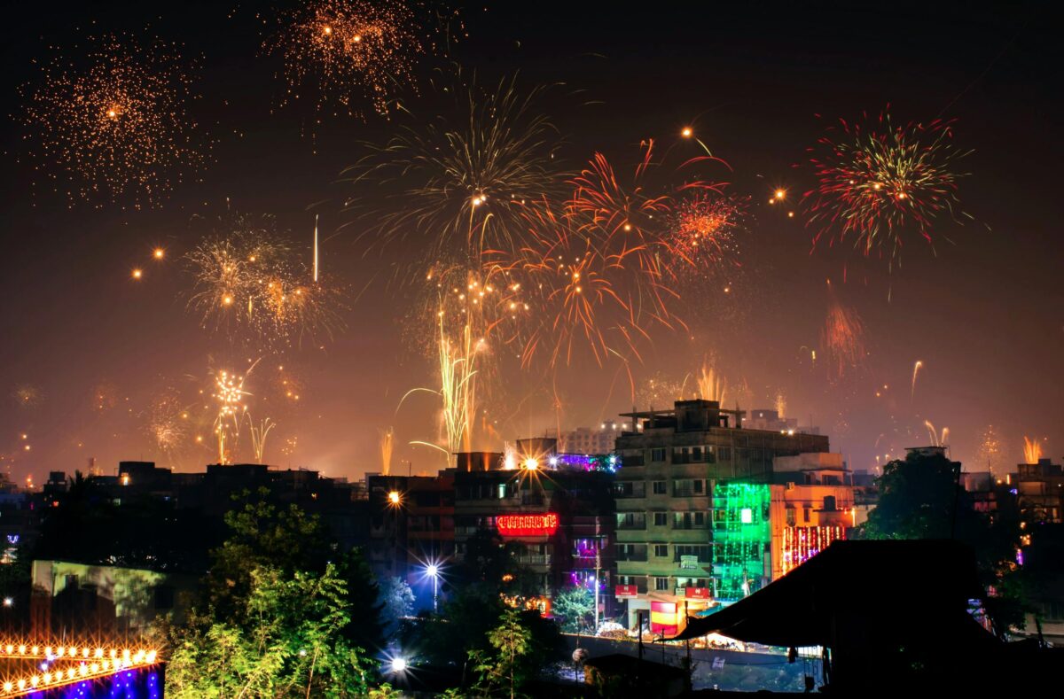 Vibrant fireworks light up the night sky during a diwali festival in an Indian city.